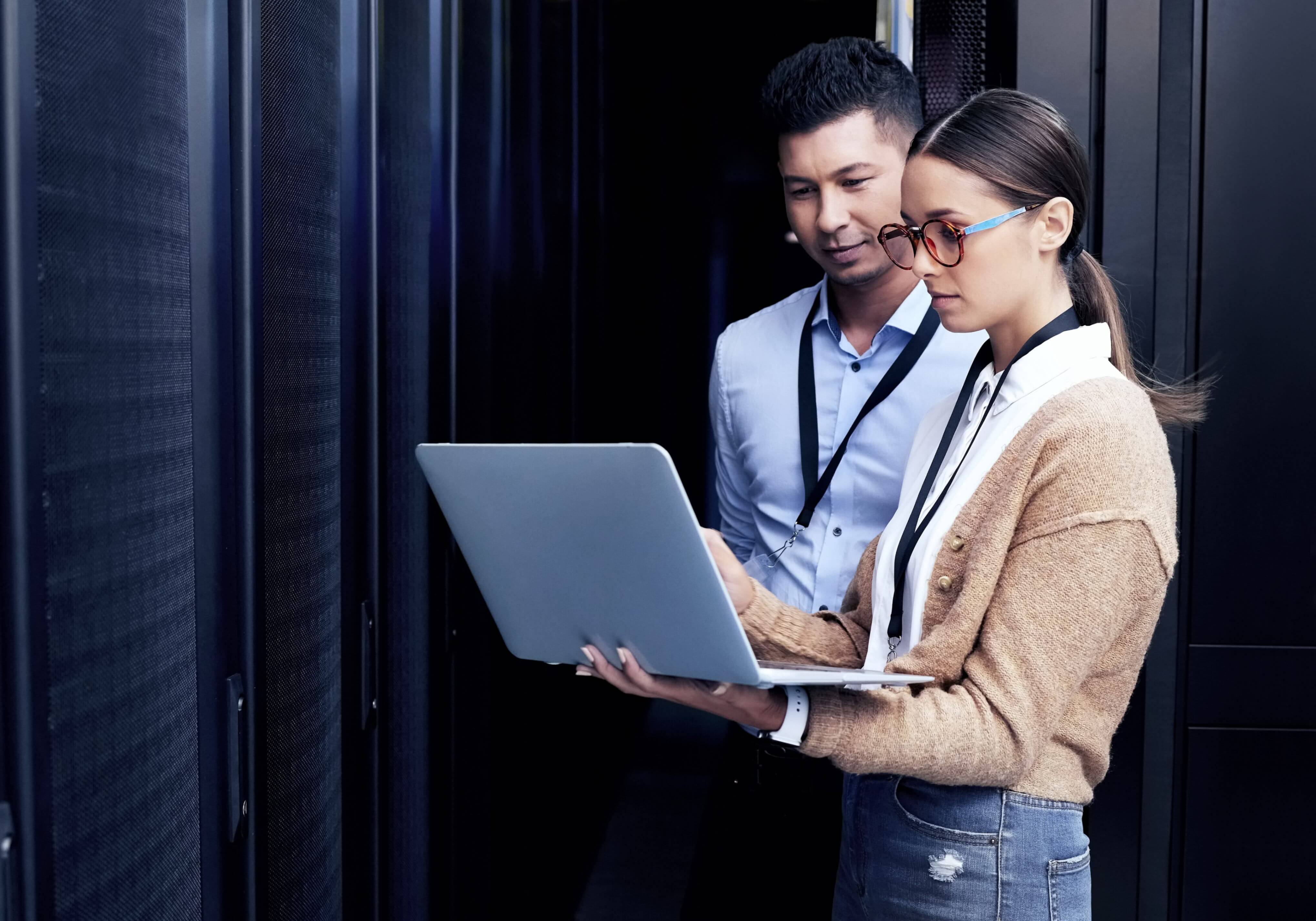 Two individuals viewing computer content, symbolizing engagement with The Humphrey Group's Leadership Development Resources