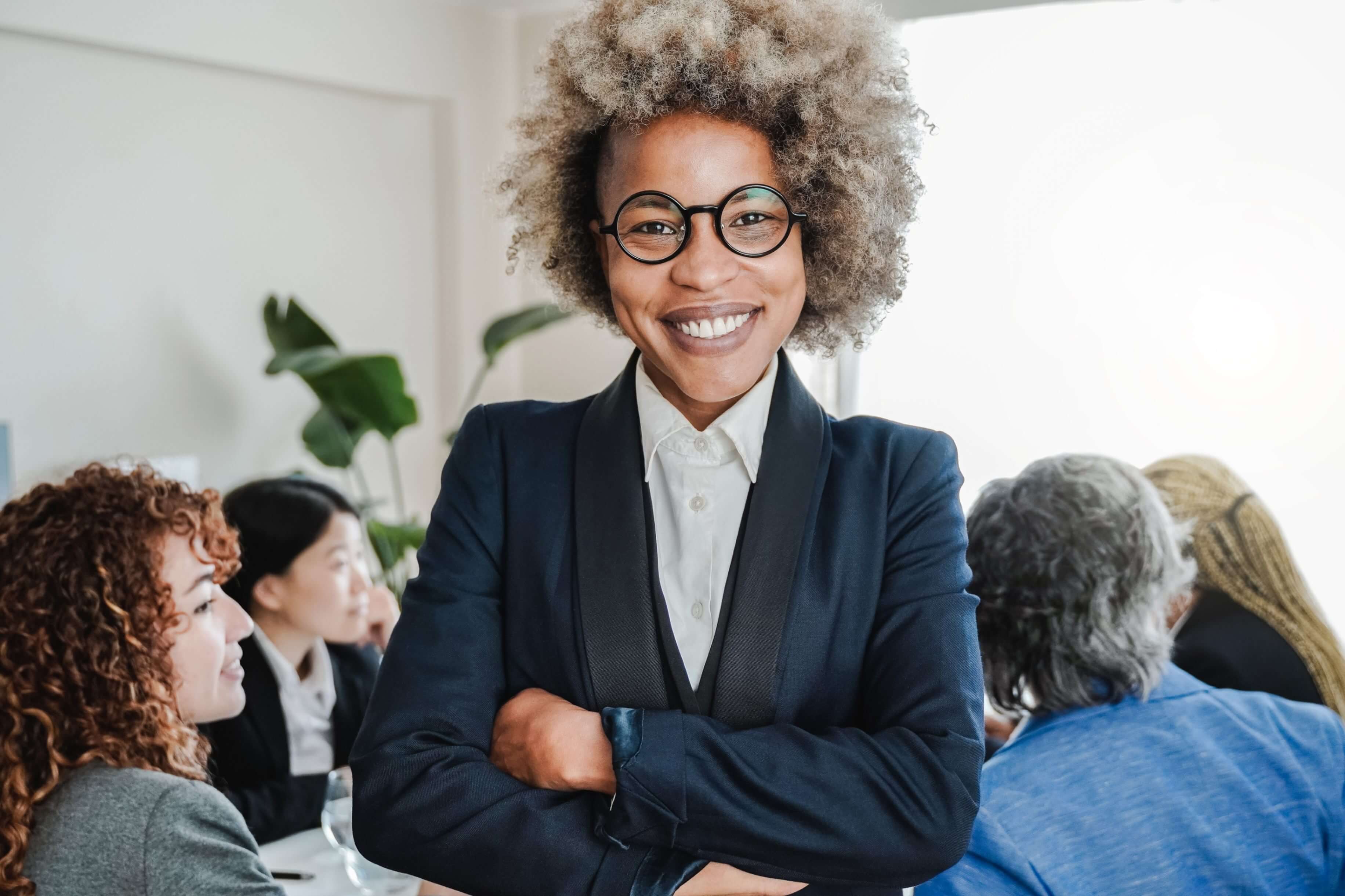 Smiling woman embodying the friendly and approachable spirit of how easy it is to contact The Humphrey Group for leadership development training.