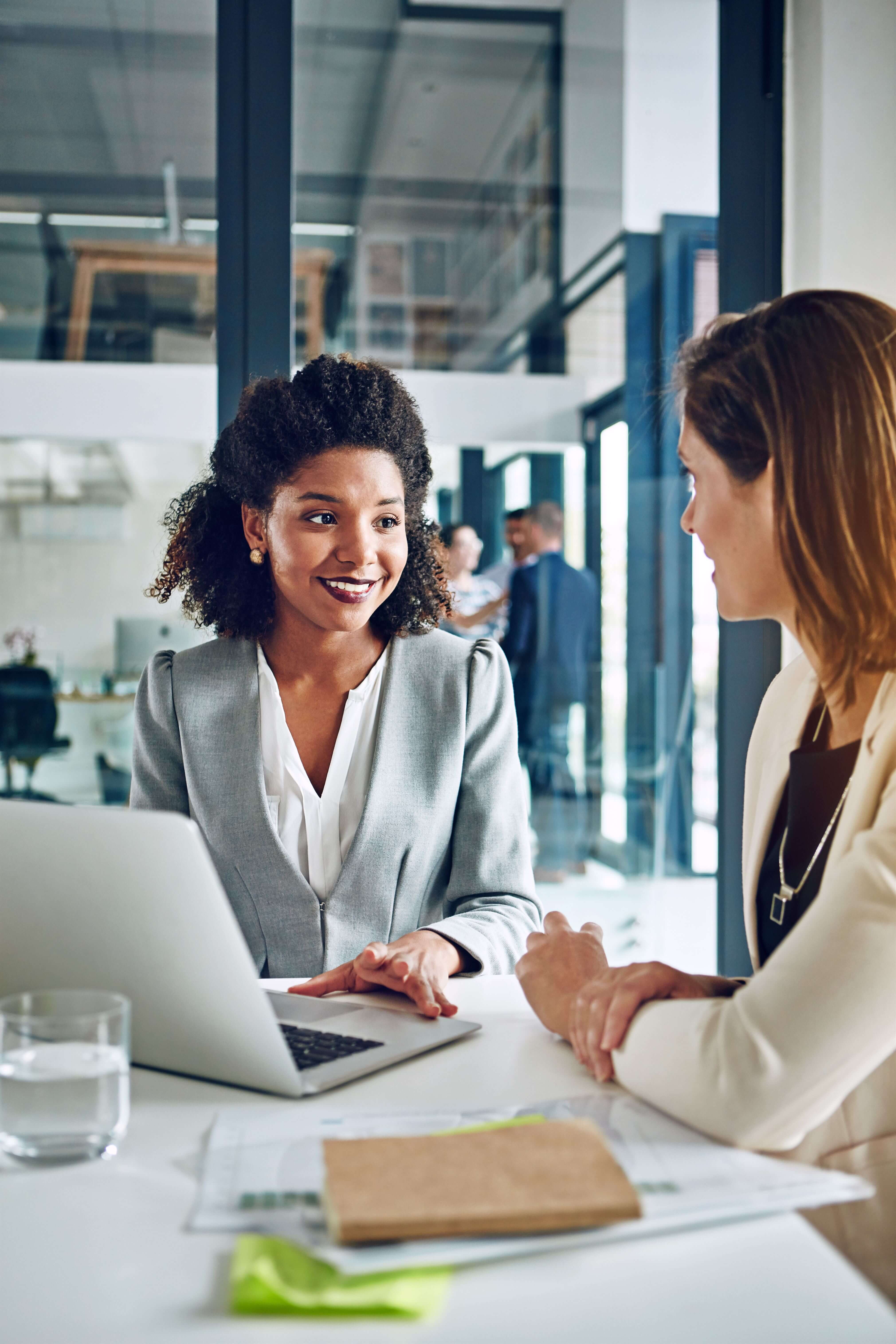 Women executives planning sustainability strategies, showcasing The Humphrey Group's commitment to global prosperity